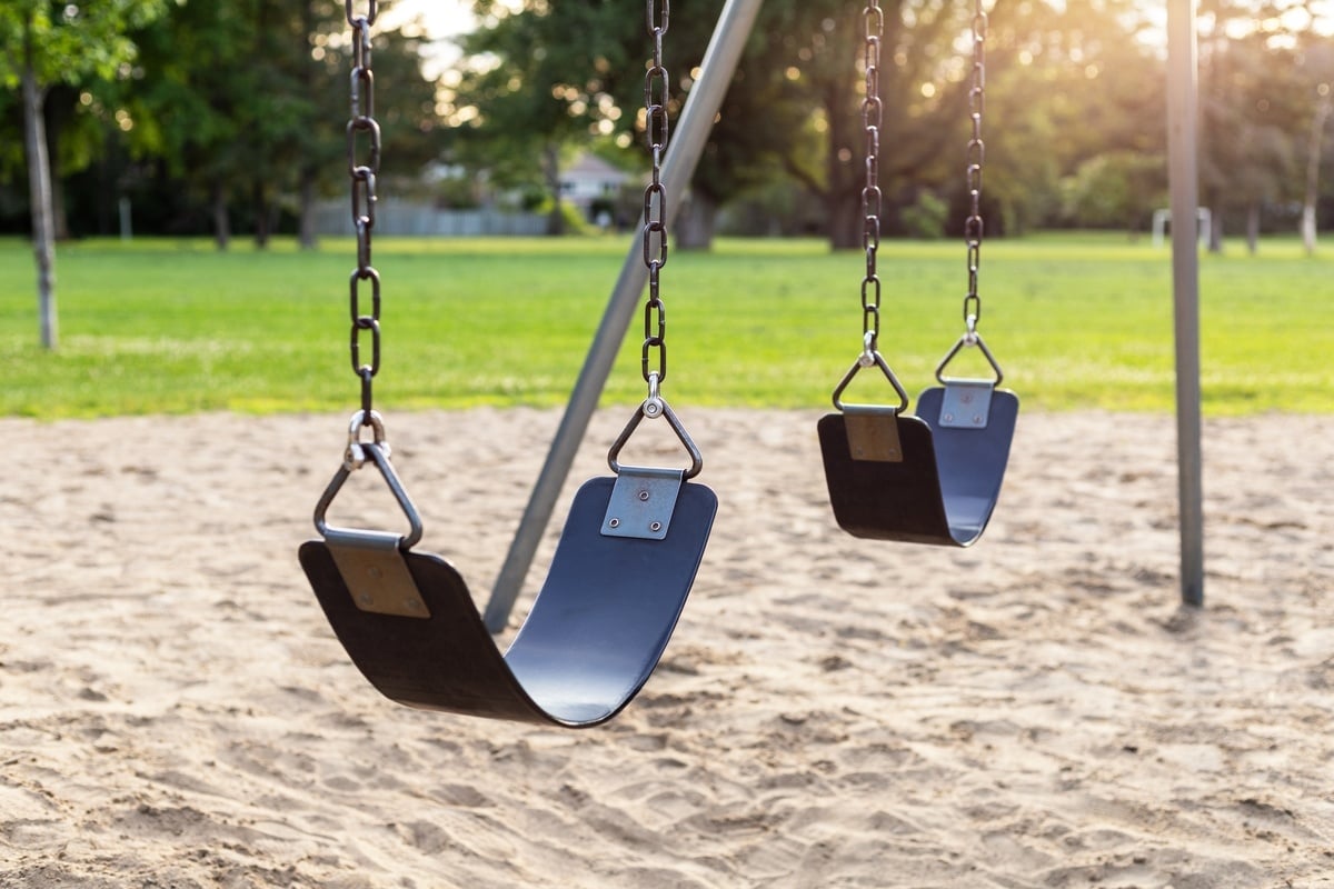 playground with swings in the public