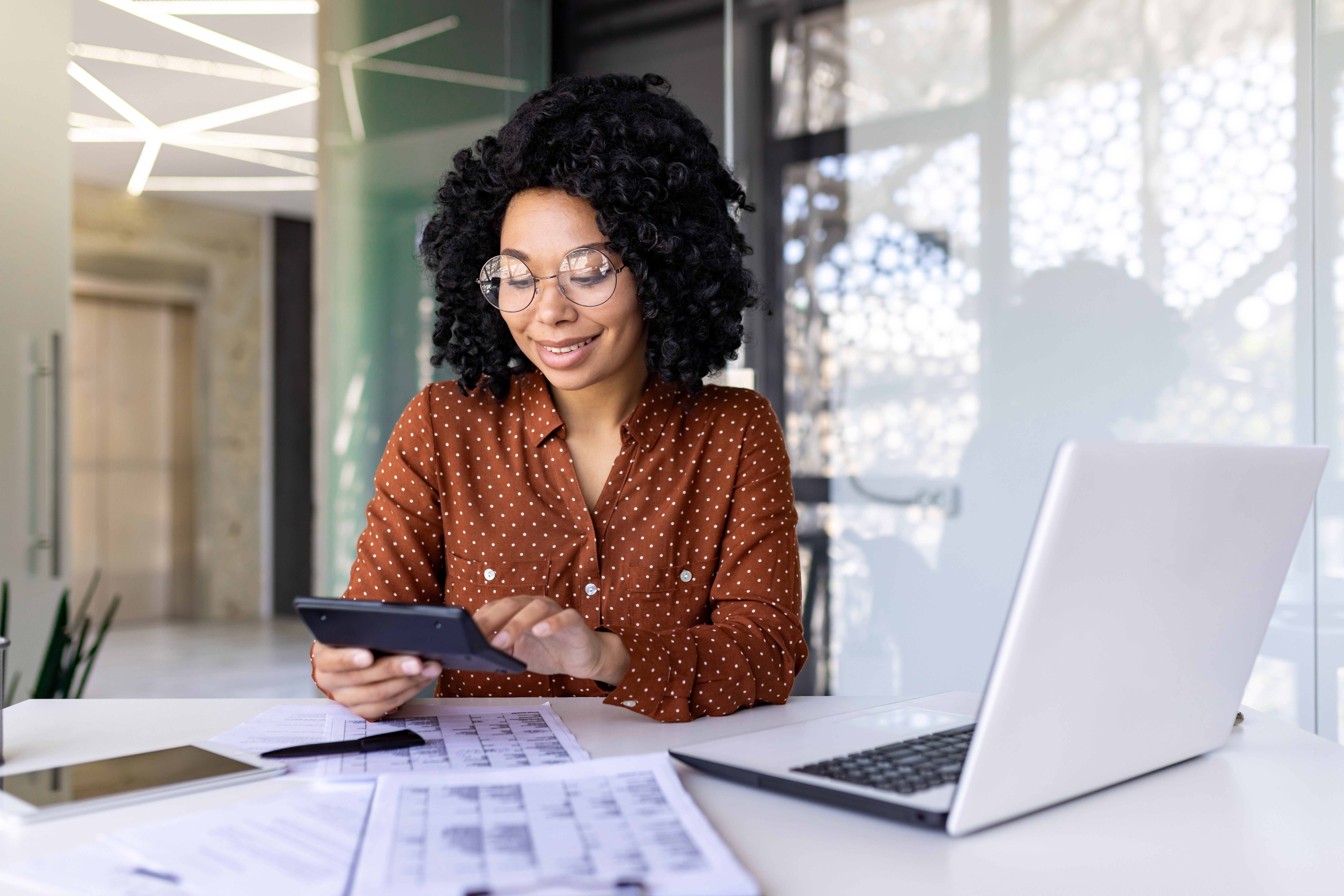 This image is of a person working in the office, representing understanding rental performance for your Florida property. 