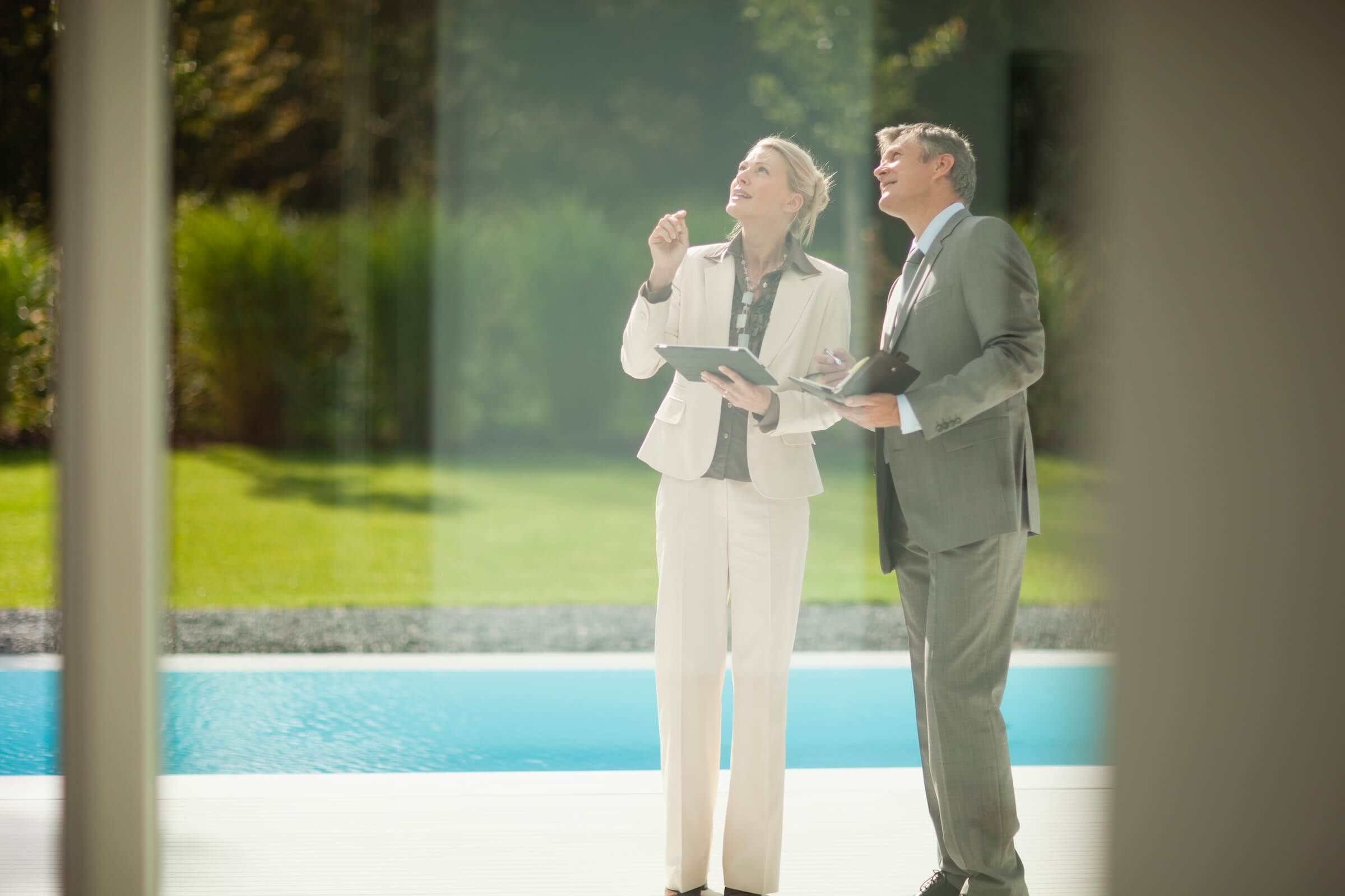 Female realtor and male real estate investor tour prospective Florida rental property
